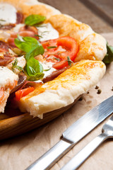 Italian pizza served on wooden table