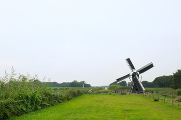Dutch windmill near the river © Ivonne Wierink