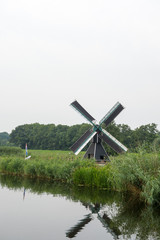 Dutch windmill near the river © Ivonne Wierink