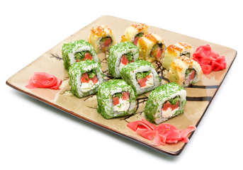 rolls and pickled ginger on the plate - white background.