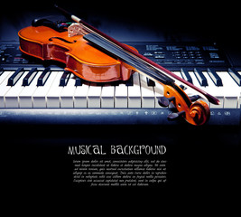 Violin and piano keys on black