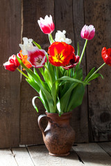 Tulip flowers in wooden background