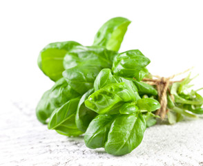 Basil leaves on kitchen table