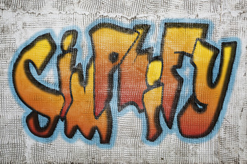 simplify word graffiti on plaster wall