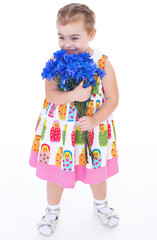 little girl with blue flowers