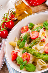 Noodles with asparagus in cream-cheese sauce