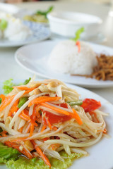 Green-papaya-salad, Thaland favorite food on table with cooked r