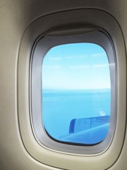 blue sky through airplane window
