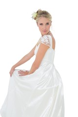 Fototapeta na wymiar Portrait of confident bride over white background