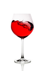 Moving red wine glass over a white background