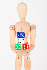 Wood mannequin holding colourful block dice isolated on white