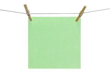 Flat green square sticky note hanged.