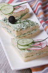 double sandwiches with soft cheese, cucumbers, radishes vertical