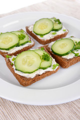 Delicious canapes on plate close-up