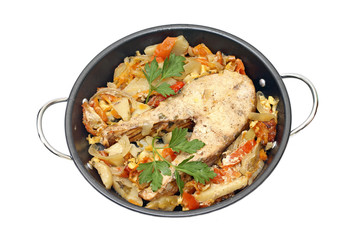 Baked fish steak with vegetables in pan