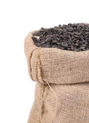 Sunflower seeds in sack close up.