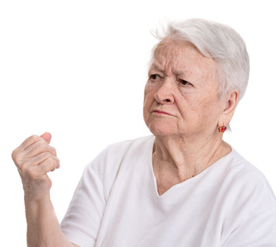 Angry old woman making fist
