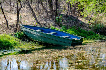 Wooden Boat and pond in a sanctuary