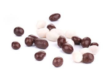 Dragee in white and black chocolate covered