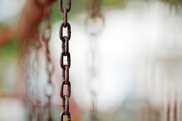 The rusty swing chains. - 63116375