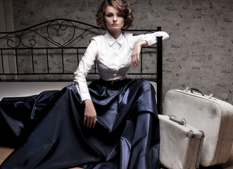 Beautiful woman in long skirt and white blouse