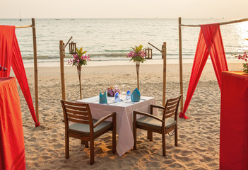 Romantic evening table for two persons on the beach.