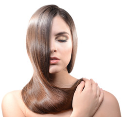 Fototapeta premium Beautiful young woman with long hair isolated on white