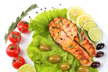 Tasty grilled salmon with vegetables, isolated on white