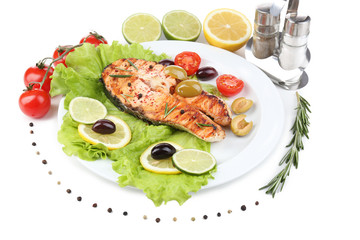 Tasty grilled salmon with vegetables, isolated on white