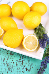 Fototapeta na wymiar Still life with fresh lemons and lavender on wooden table