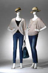 female clothing in jeans with bag ,hat on two mannequin