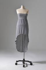 Full length fashion female clothing in hat on mannequin