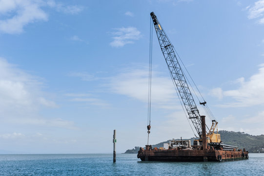 Floating barge with a large crane