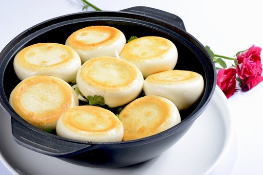 Chinese Food: Toasted Dumplings in a black pot