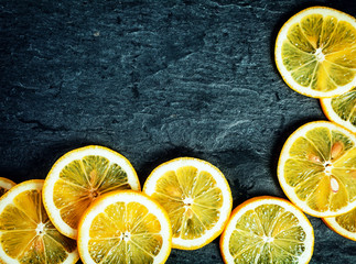 Orange slices on a slate background