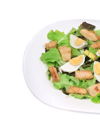 Close up of caesar salad with eggs.