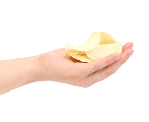 Hand holds potato chips.