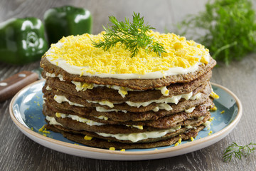 Cake pancakes from the liver with eggs and greens.