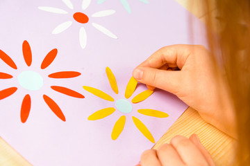 Girl makes a greeting card