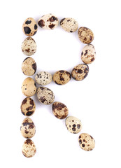 quail eggs in the form of letter R.