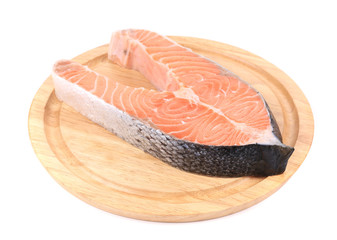 Fillet of fresh raw fish on wooden board