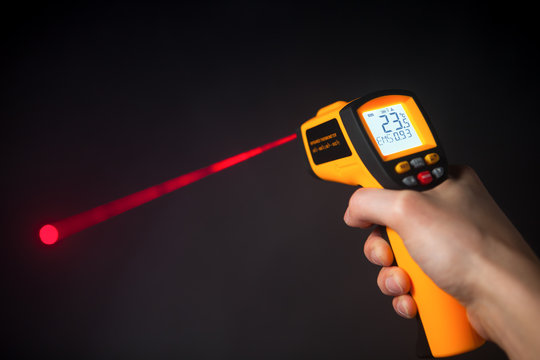 infrared laser thermometer in hand