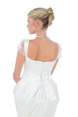Fototapeta na wymiar Rear view of bride over white background