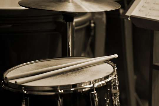 Drum sticks lying on the drum closeup