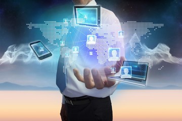 Businessman presenting earth interface with connecting devices