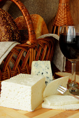 Glass of red wine, homemade cheese, cheese