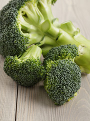 fresh broccoli on wood board