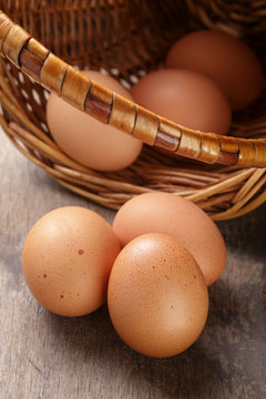 speckled chicken eggs on old table