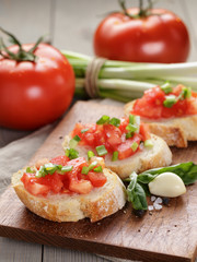 Fototapeta na wymiar simple italian appetizing bruschetta with tomato
