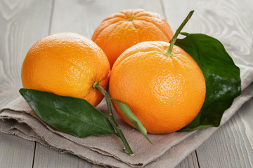 ripe oranges on wooden table © GCapture